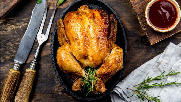 A beautifully roasted chicken resting on a serving platter