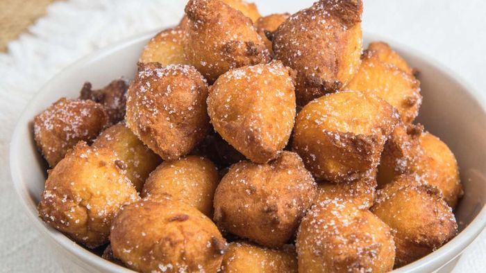 Fried dough balls arranged on a platter