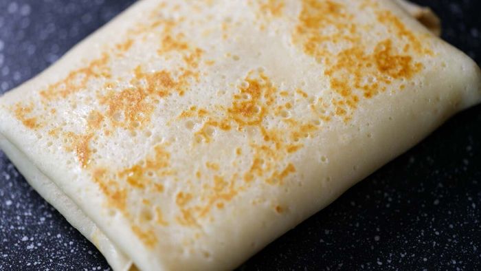 A folded rectangular piece of dough.
