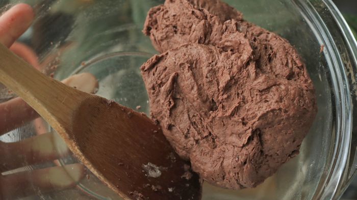 Chocolate dough sitting in a bowl.