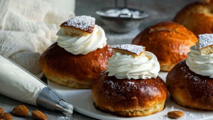 Semlor buns on a plate.