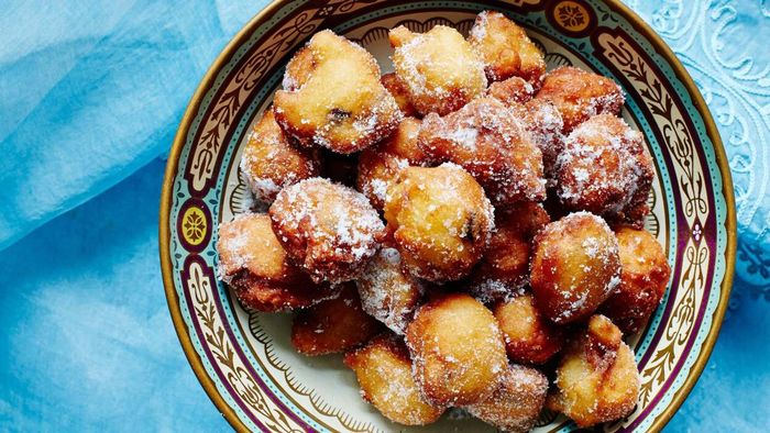 Fried dough balls in a bowl.