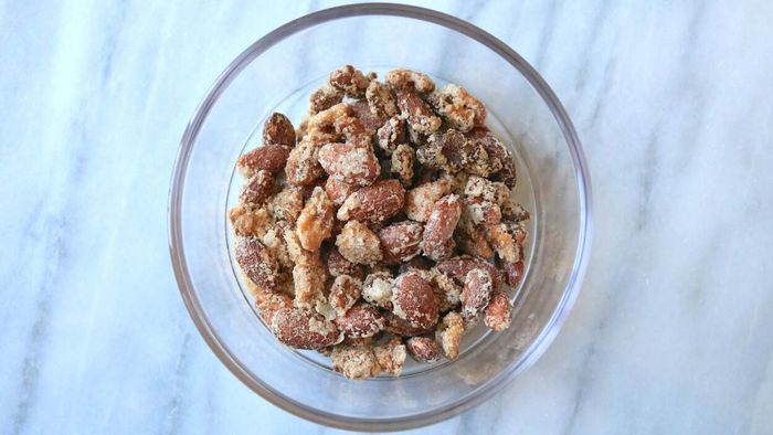 A small bowl of candied mixed nuts.