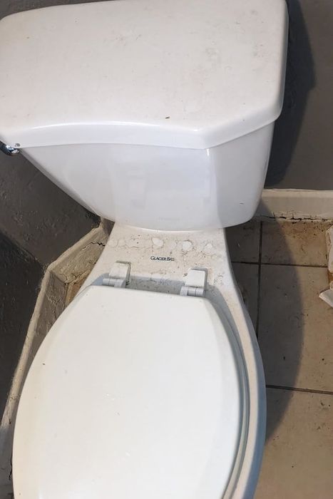 A soiled white toilet