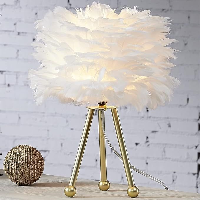 A white lamp glowing softly on a desk.