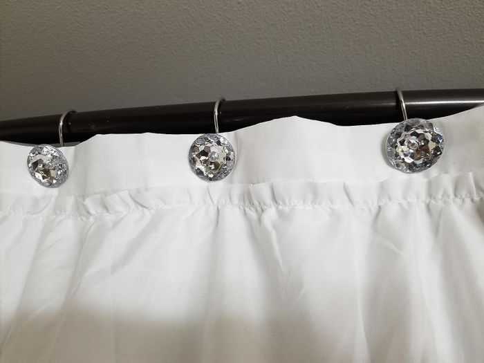 A reviewer's silver curtain holders displayed elegantly.