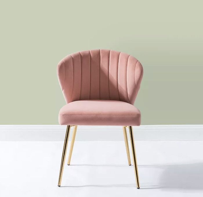 A pink velvet accent chair.
