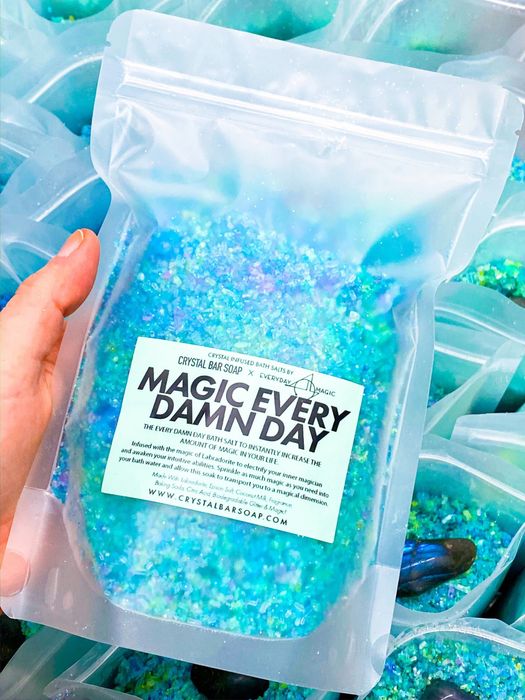 A package of bath salts featuring various shades of blues and greens.