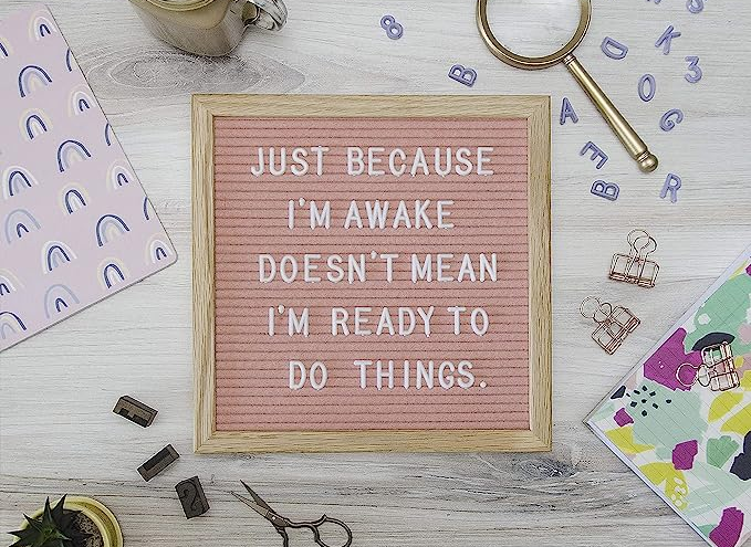 A pink letter board with words that say