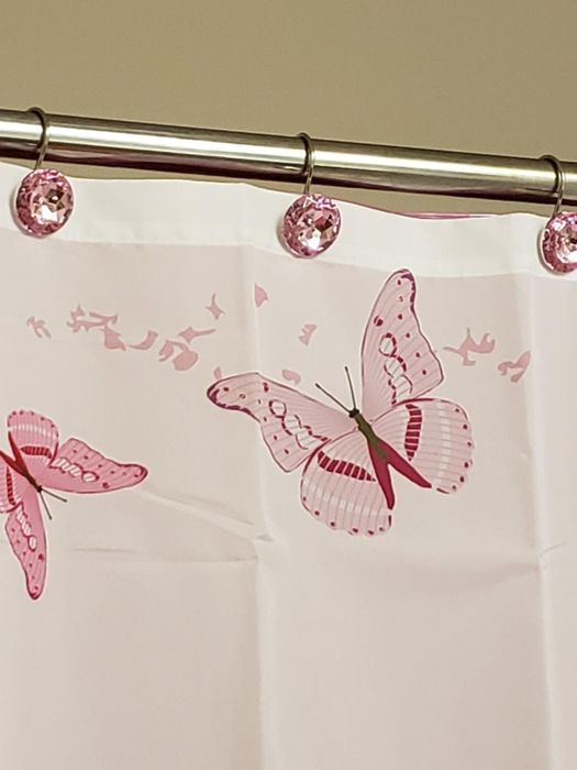 A reviewer's pink curtain holders adding a soft touch to the room.