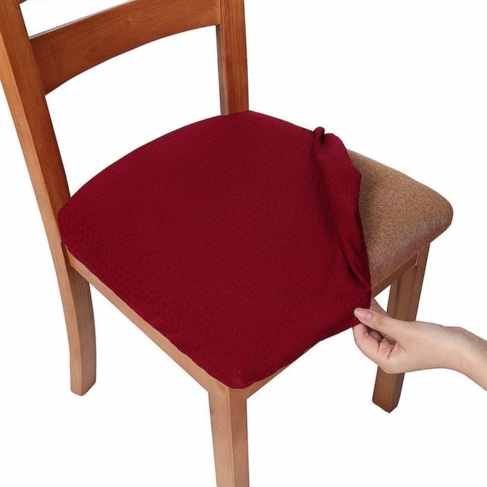 A red removable slipcover draped over a chair.
