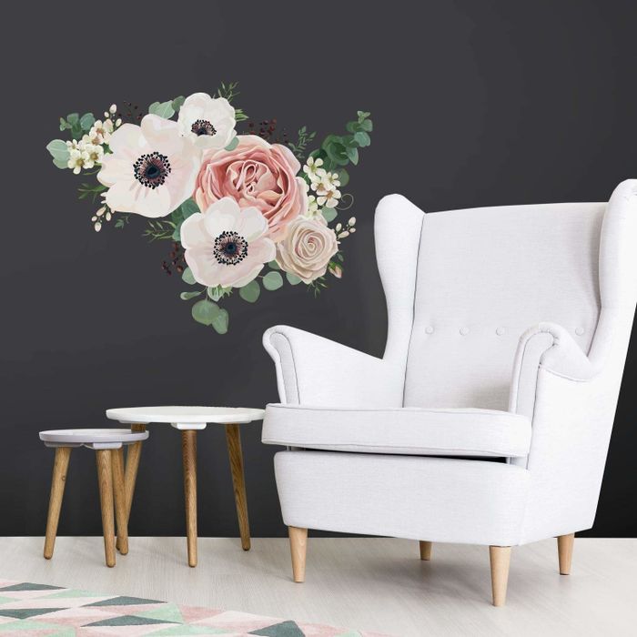 A large decal featuring a pink and green flower cluster on a wall.
