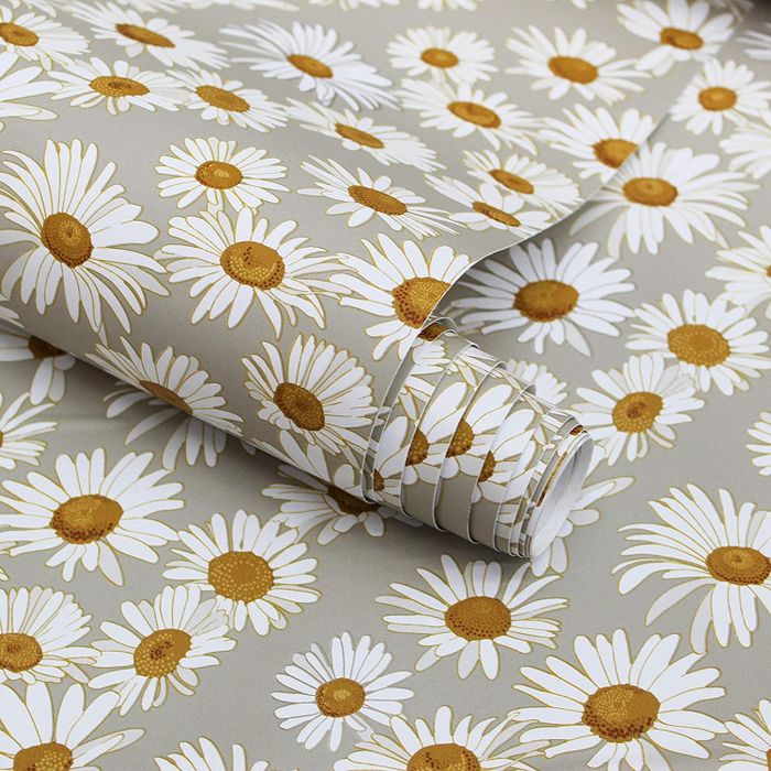 A detailed view of the wallpaper reveals a vintage-inspired design, with a light gray base and a white and yellow daisy pattern.