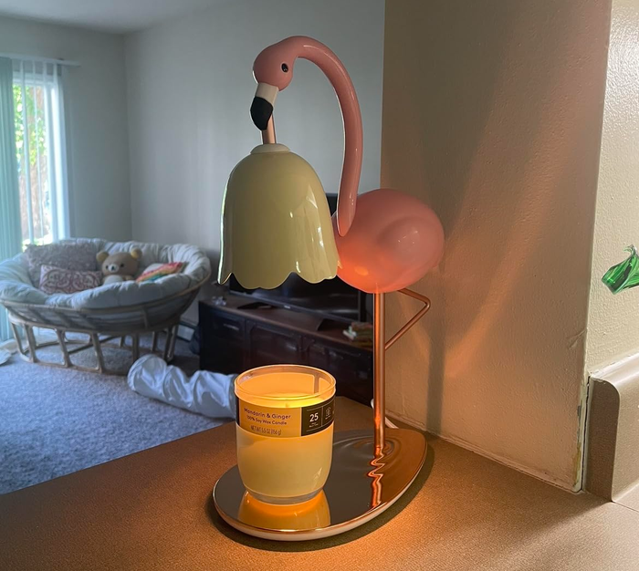 A flamingo candle warmer in action, gently warming a candle