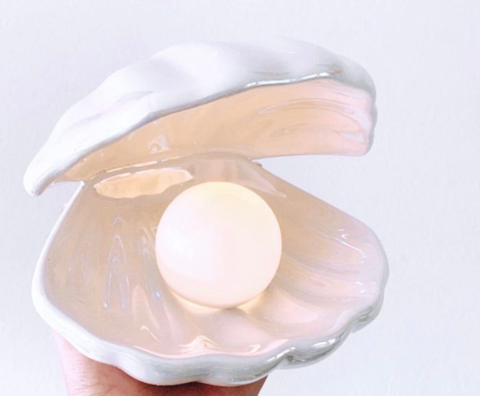 A close-up view of the white ceramic shell with the LED light inside.