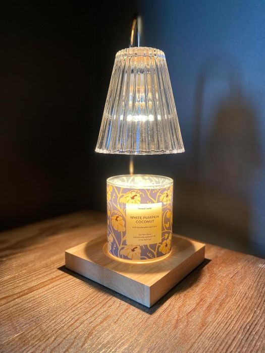 Candle positioned beneath a candle warmer