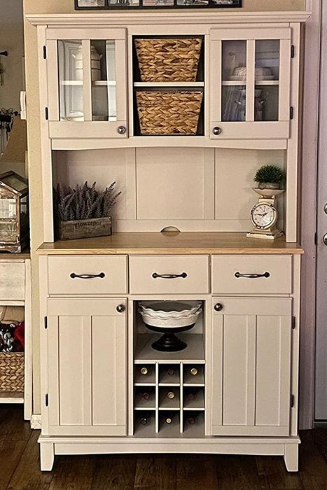 A reviewer's photo of the hutch cabinet in the off white colorway