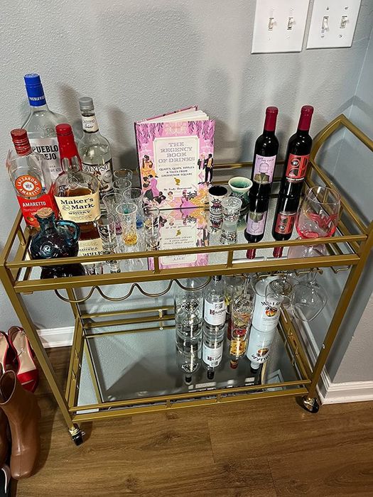 A reviewer’s photo of the bar cart stocked with bottles