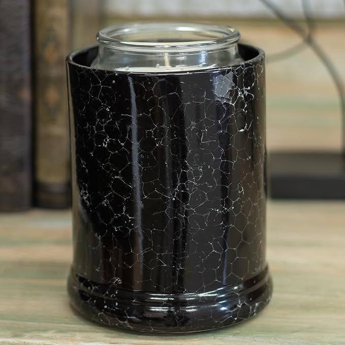 A black marble-style candle crock, blending elegance with practicality.