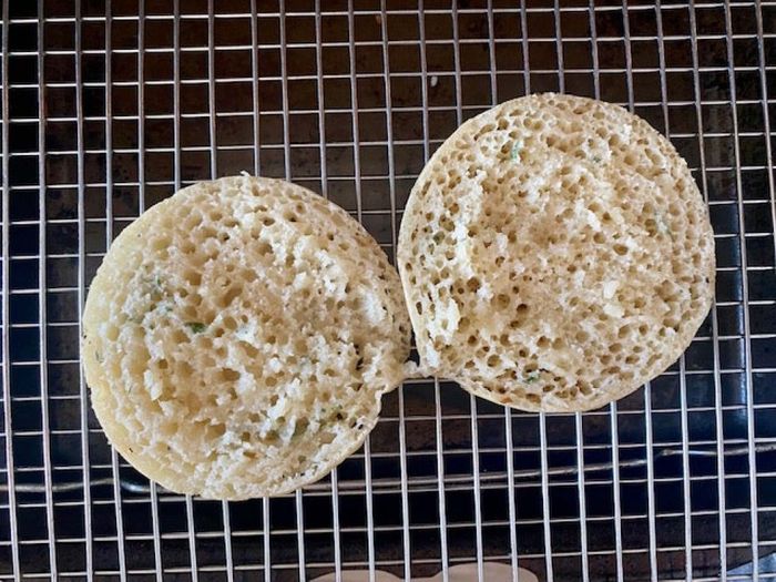 Slice the crumpet open and place it on a wire cooling rack.