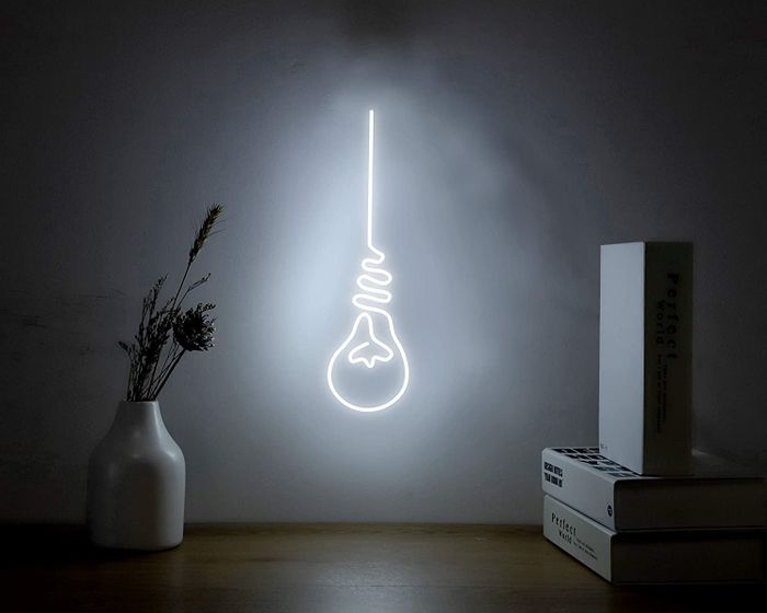 The neon lightbulb sign.
