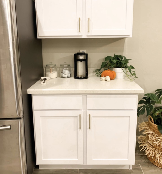 A photo from the reviewer featuring pristine white cabinets.