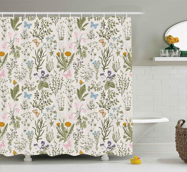 A shower curtain adorned with floral and butterfly patterns.