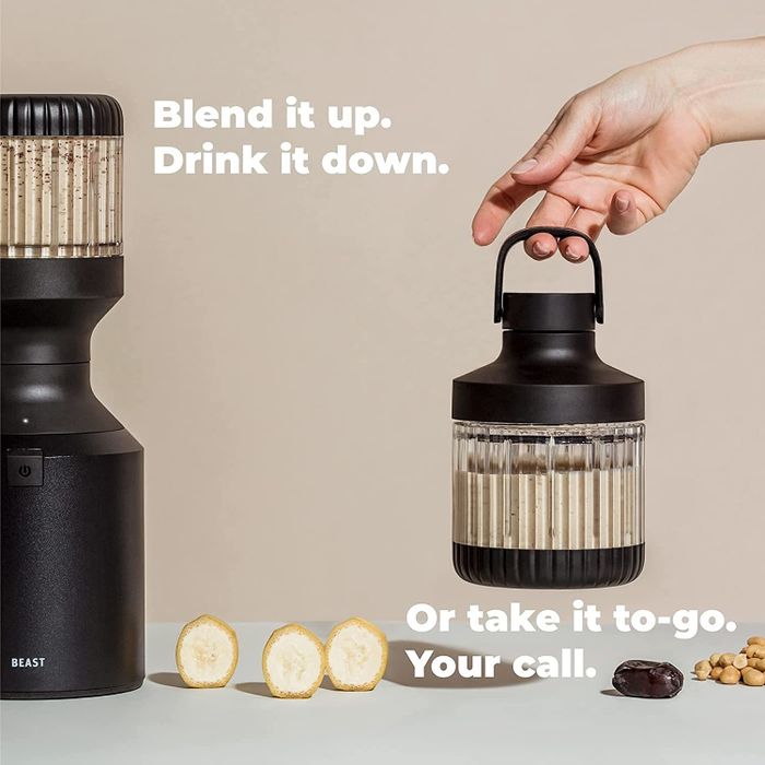 The blender, dressed in black, featuring the travel lid with a handle for easy transport