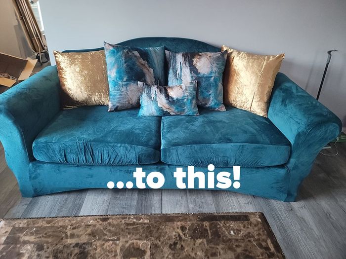 The same couch after the transformation, now dressed in a vibrant blue slipcover with gold and pink accent pillows, looking stunning.