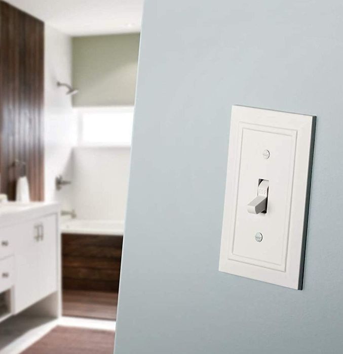 A white single switchplate featuring a beveled edge detail for a sleek, modern look.