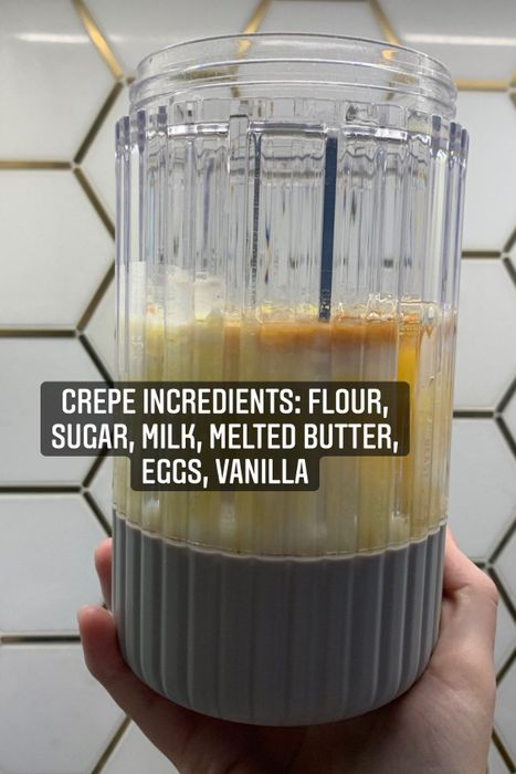 The ingredients for the crepes before blending: flour, sugar, milk, melted butter, eggs, and vanilla