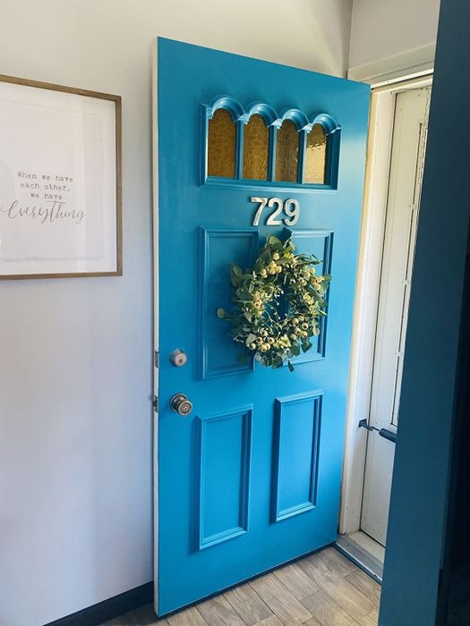 after: the same door, now in a striking bright blue