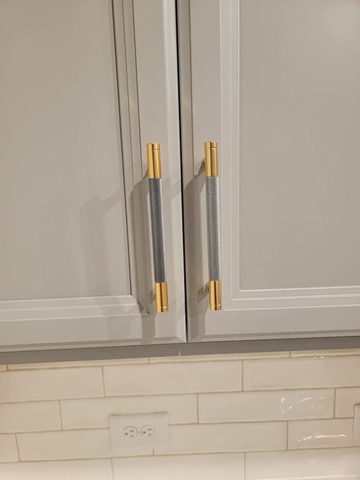 A photo from the reviewer showing the newly installed handle pulls on their cabinet.