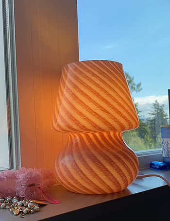 A mushroom lamp featuring a pink and white striped design.