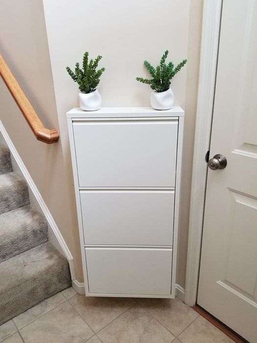 The same cabinet with the doors closed, no shoes in sight, creating a clean, clutter-free look.