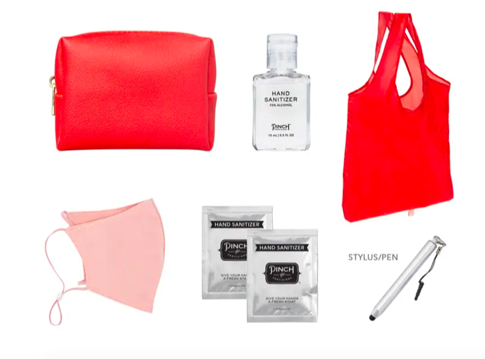 The kit includes a bag, a tote, hand sanitizer, a mask, a stylus pointer, and wipes.