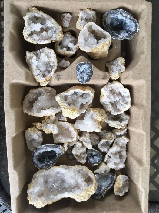A tray brimming with glittering geodes just waiting to be cracked open and explored.