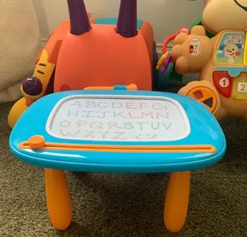 A children's magnetic drawing board featuring the alphabet from A to Z