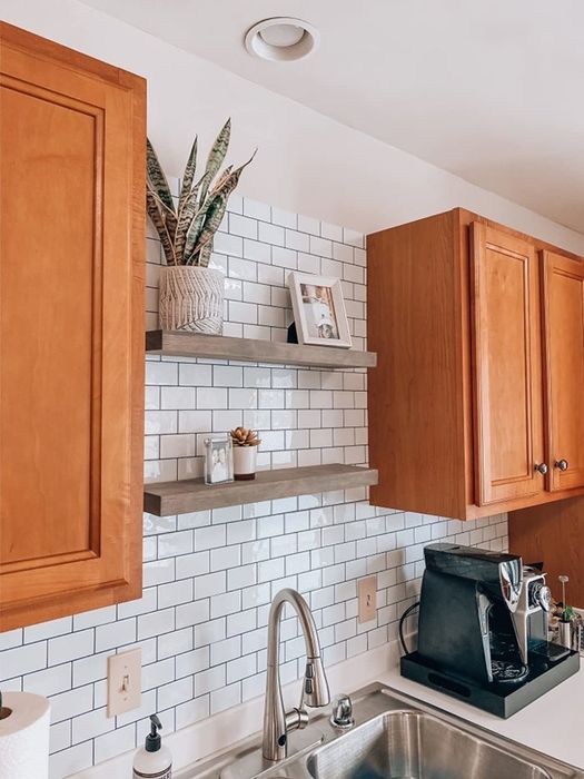 A photo of white subway tiles used as a backsplash in a kitchen, adding a timeless, clean look.