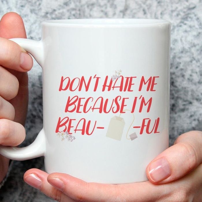 A ceramic mug that says, 