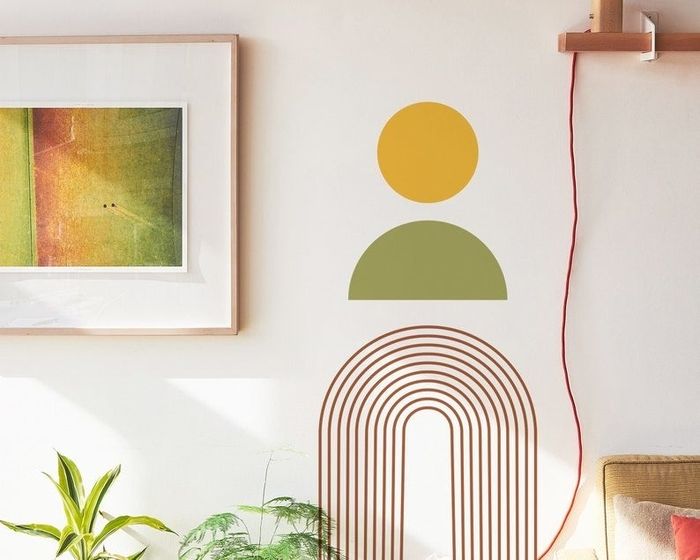 the bright yellow, green, and red decal on the wall