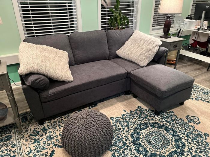 A small sectional in the reviewer's living room.
