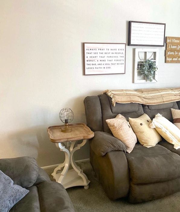 A reviewer’s living room features the side table next to a sofa, complementing the overall decor.