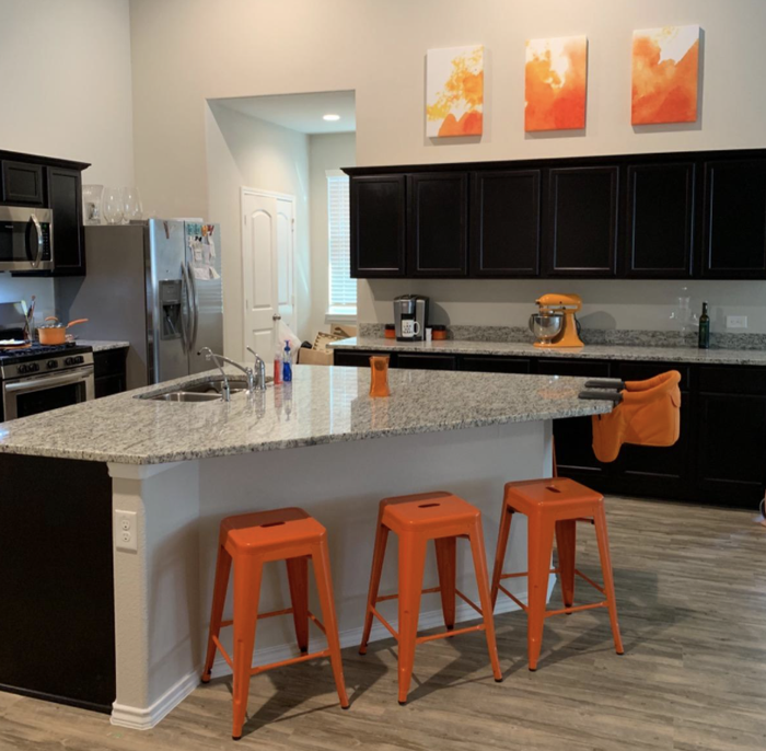 The reviewer's kitchen featuring orange barstools.