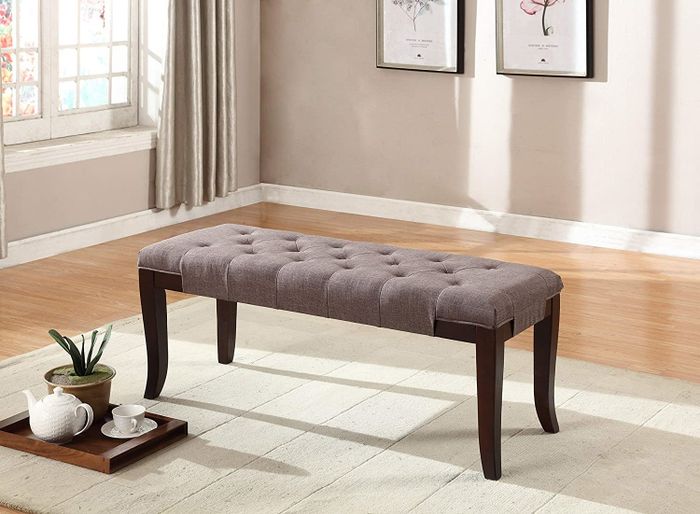 The brown rectangular bench featuring flared legs, offering a clean and modern look.