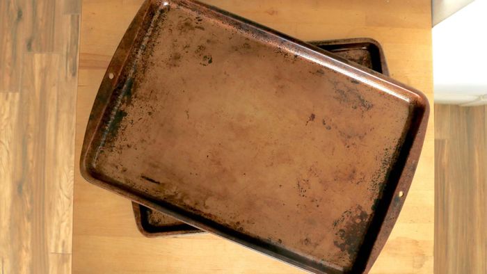 Two sheet trays stacked at an angle.