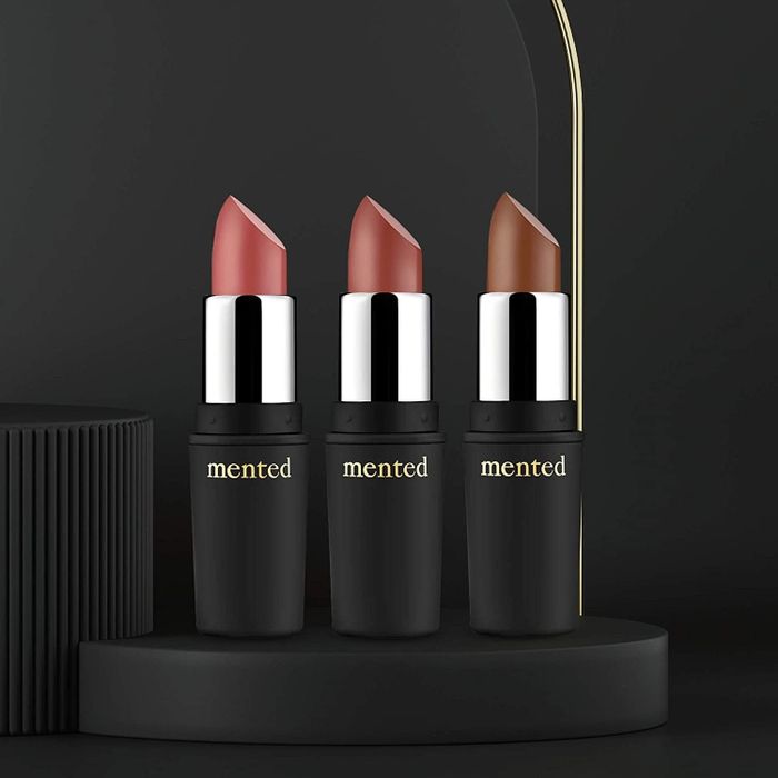 Three lipsticks, their caps removed to showcase the different shades inside.
