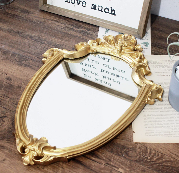 A mirror resting flat on a table