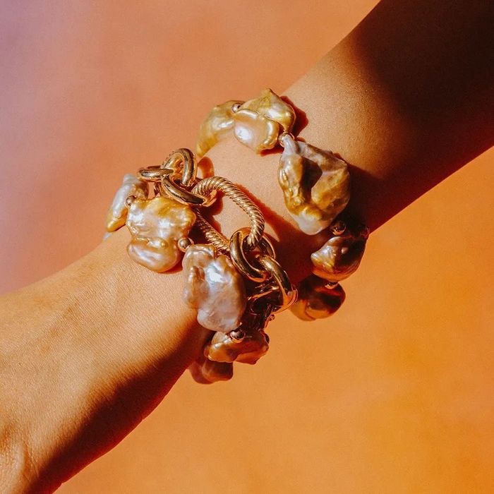 A bold chain bracelet featuring abstract gemstones.