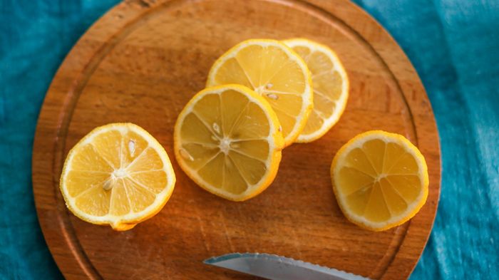 Sliced lemons on a cutting board